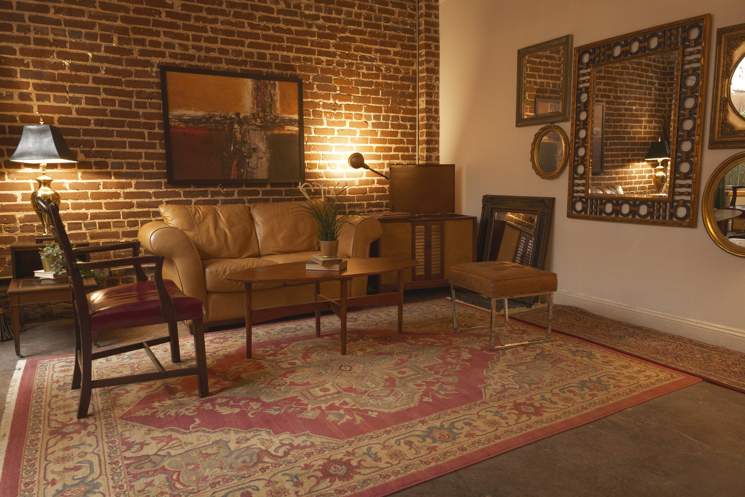 The reading room — brick, leather, warm lamps