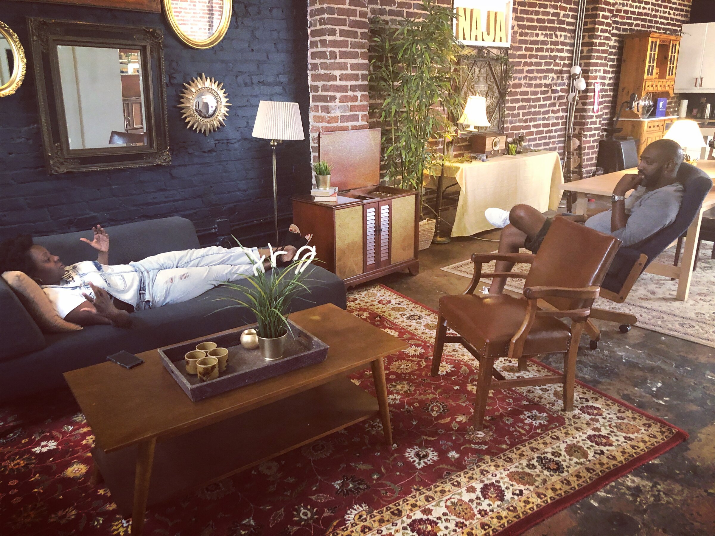 A warm sitting area with leather chairs and rug